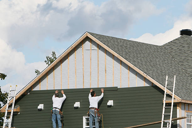 Professional Storm Damage Siding Repair technician working in Lawrence, NY
